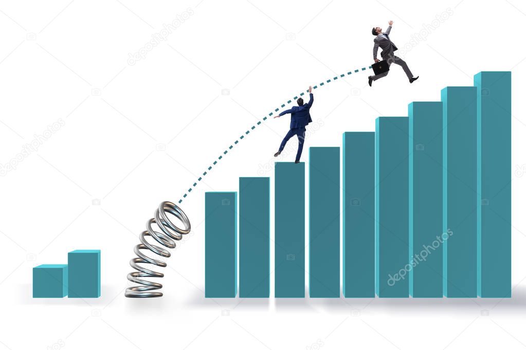 Businessman outperforming his competition jumping over