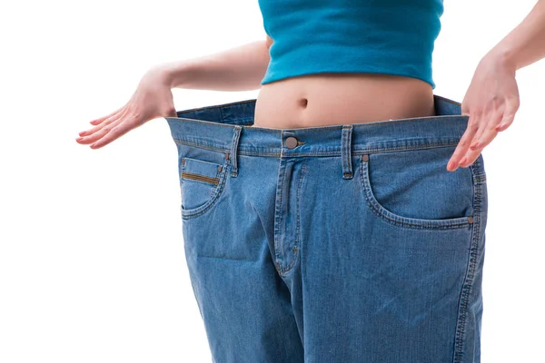 Concept of dieting with oversized jeans — Stock Photo, Image