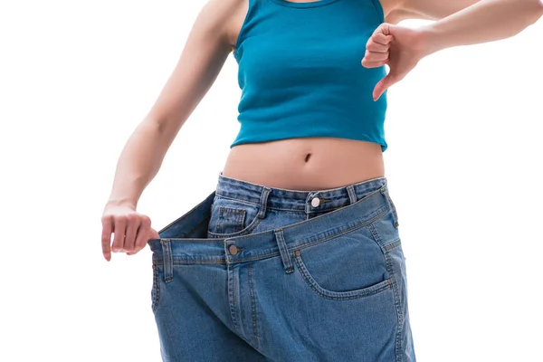 Concept of dieting with oversized jeans — Stock Photo, Image