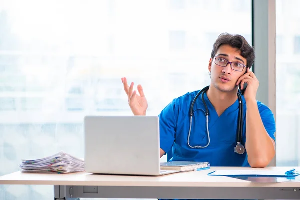 Young handsome doctor working in the hospital — Stock Photo, Image