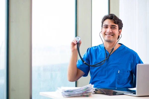 Young handsome doctor working in the hospital — Stock Photo, Image
