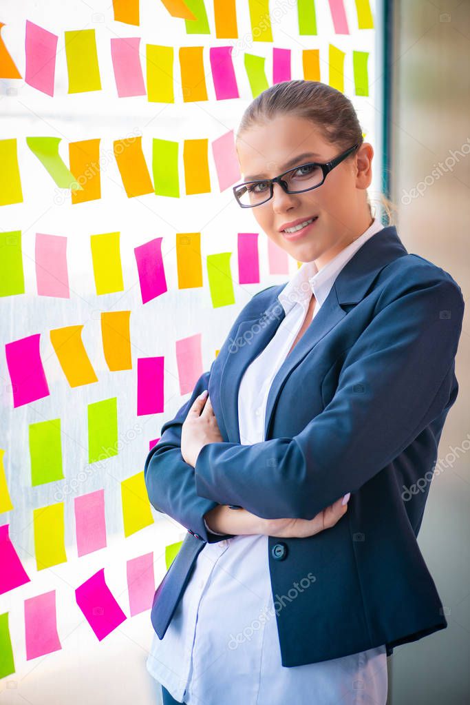 Beautiful female employee with many conflicting priorities 