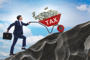 İşadamı vergi arabalarını yokuş yukarı itiyor