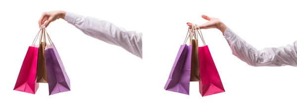 Kézben tartó bevásárló táskák karácsonyi vásárlás fehér háton — Stock Fotó
