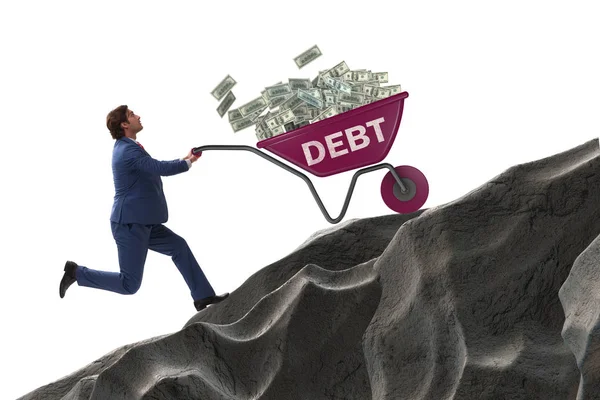 Zakenman duwen kruiwagen bergop in de schuld lening concept — Stockfoto