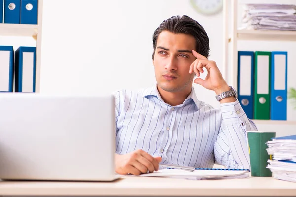 Young employee sitting at the office — Stock Photo, Image