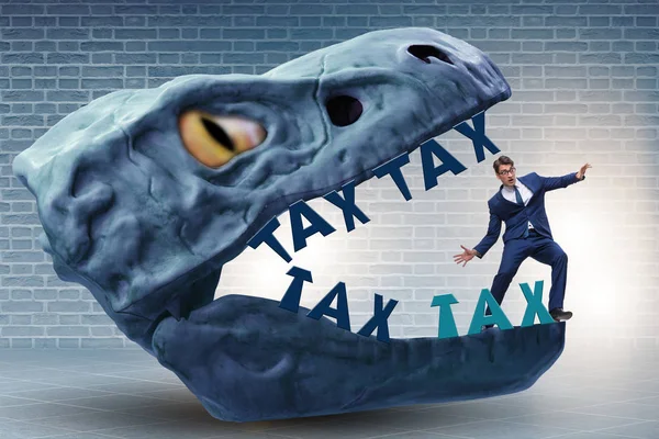 Businessman in the jaws of high taxes — Stock Photo, Image