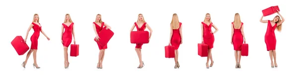Blondine im roten Kleid mit Koffer auf weißem Hintergrund — Stockfoto