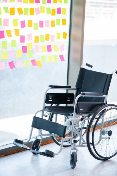 Young handsome man in wheelchair with many conflicting prioritie — Stock Photo, Image