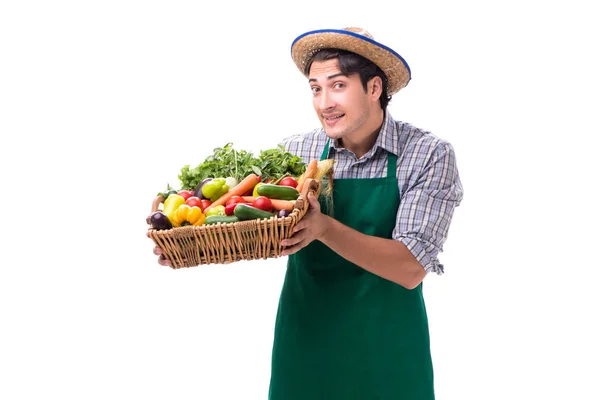 Νεαρός γεωργός με φρέσκα προϊόντα απομονωμένα σε λευκό φόντο — Φωτογραφία Αρχείου
