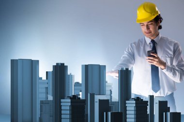 Gelecekçi mimar şehir planlaması yapıyor.