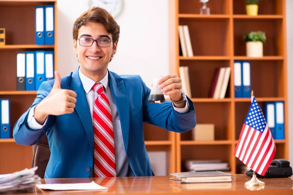 Young handsome politician sitting in office — Stock Photo, Image