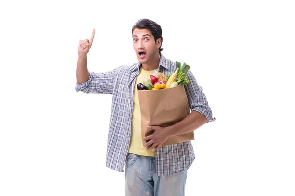 Young man with his grocery shopping on white — Stock Photo, Image