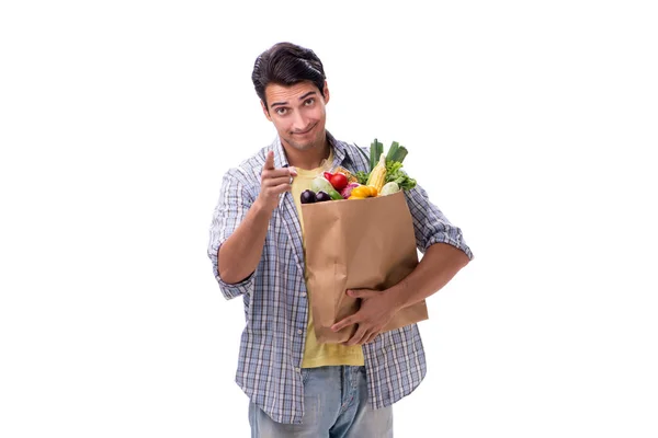 Joven con su tienda de comestibles en blanco —  Fotos de Stock