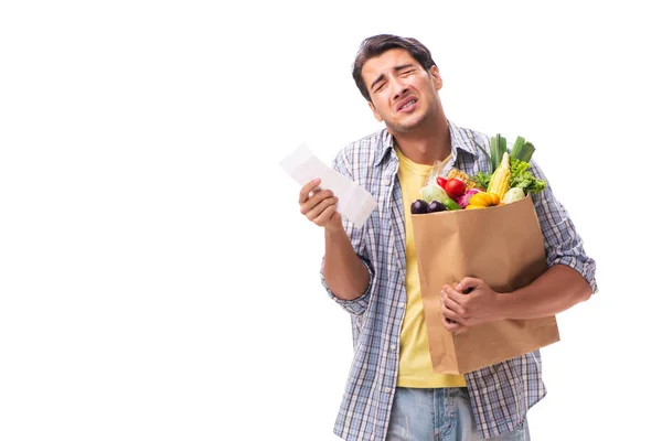 Young man with his grocery shopping on white — Stock Photo, Image