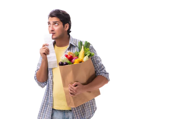 Joven con su tienda de comestibles en blanco — Foto de Stock