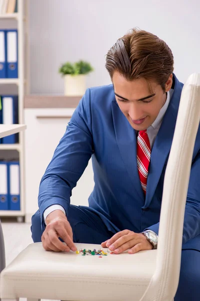 Office prank with sharp thumbtacks on chair — Stock Photo, Image