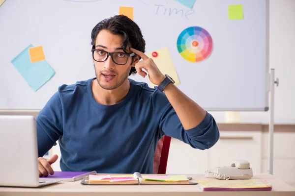 Young handsome designer working at the project — Stock Photo, Image