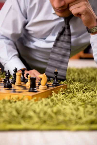 Young handsome boss playing chess during break — Stock Photo, Image