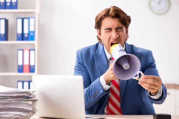 Deaf employee using hearing aid in office — Stock Photo, Image