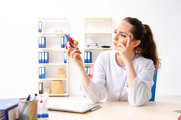 Young female doctor cardiologist sitting at the hospital — Stock Photo, Image