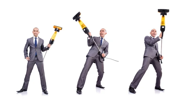 Businessman doing vacuum cleaning on white — Stock Photo, Image