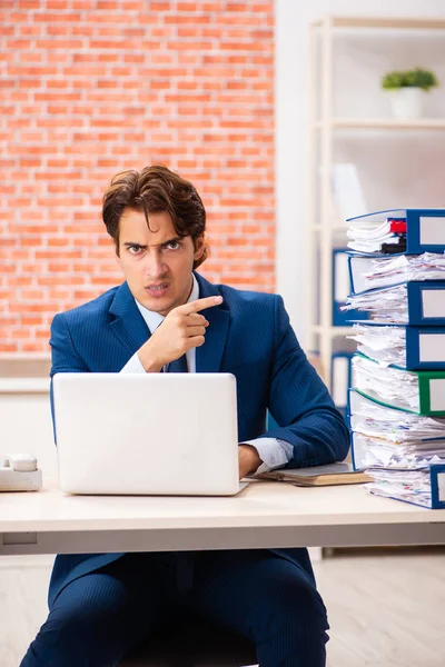 Young elegant man unhappy with too much work