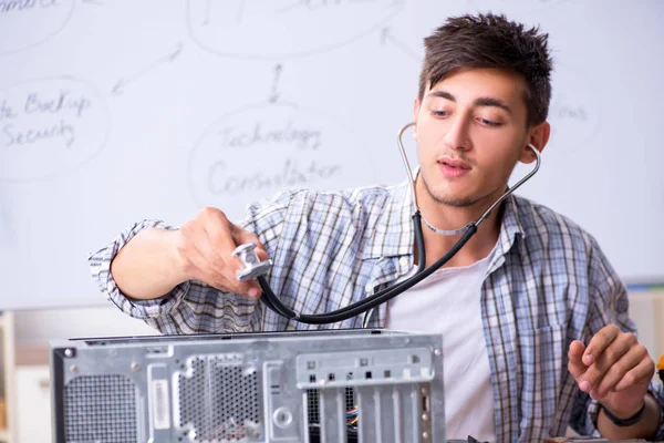 Young it specialist in front of the whiteboard