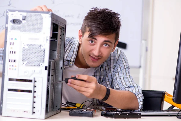 Young it specialist in front of the whiteboard