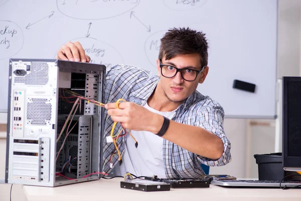 Young it specialist in front of the whiteboard