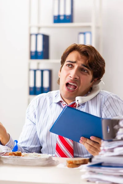 Man having meal at work during break