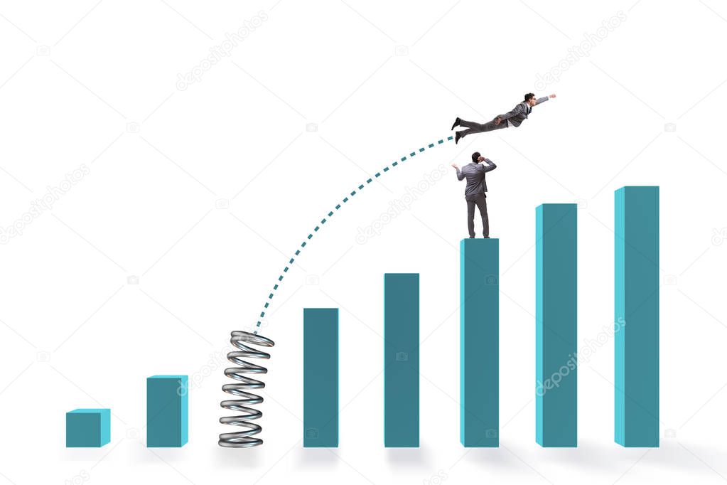 Businessman outperforming his competition jumping over