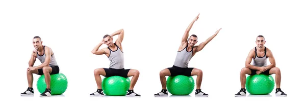 Hombre con pelota suiza haciendo ejercicios en blanco — Foto de Stock