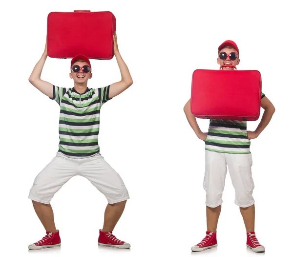 Young man with red suitcase isolated on white — Stock Photo, Image