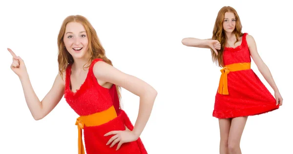 Krásná mladá dívka v červených šatech ukázala, izolované na bílém — Stock fotografie