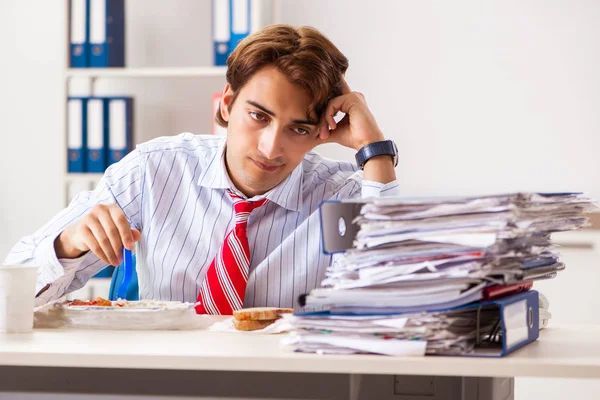 Man having meal at work during break