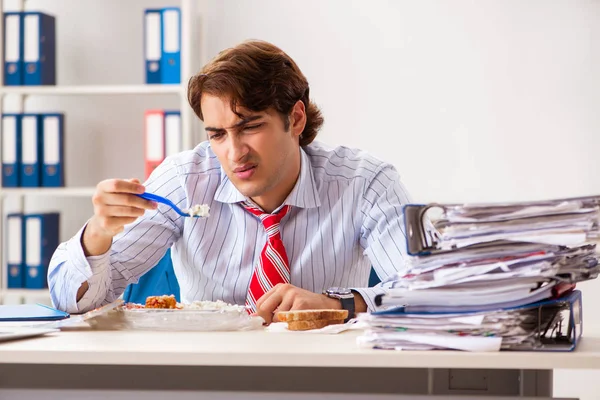 Man having meal at work during break