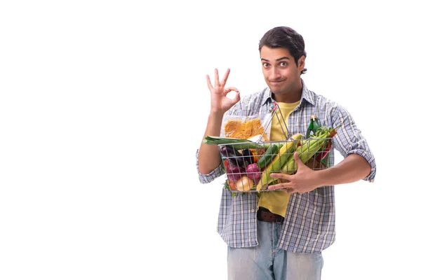 Jongeman met zijn kruidenierswinkel op wit — Stockfoto