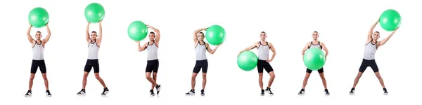 Homem com bola suíça fazendo exercícios em branco — Fotografia de Stock