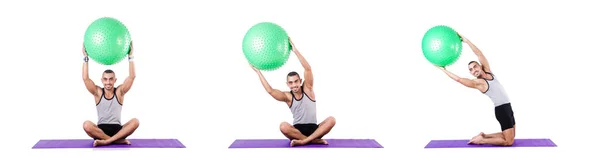 Homem com bola suíça fazendo exercícios em branco — Fotografia de Stock