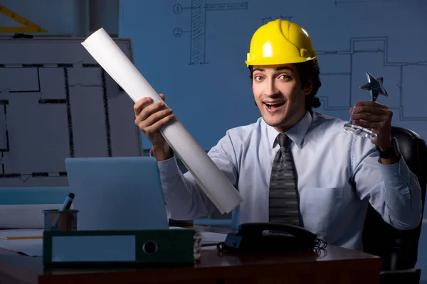 Young construction architect working on project at night — Stock Photo, Image