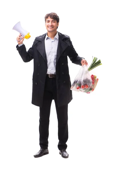 Joven hombre guapo con verduras en concepto de compras —  Fotos de Stock