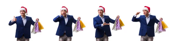 Young man with bags after christmas shopping on white background — Stock Photo, Image