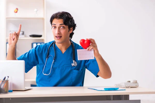 Young handsome doctor working at the clinic — Stock Photo, Image
