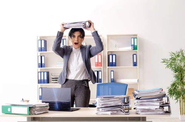 Middle aged businesslady unhappy with excessive work — Stock Photo, Image
