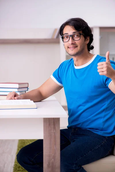 Young handsome student studying at home — Stock Photo, Image