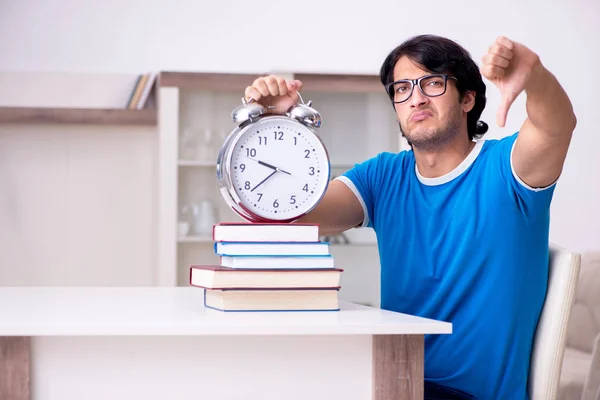 Young handsome student studying at home — Stock Photo, Image