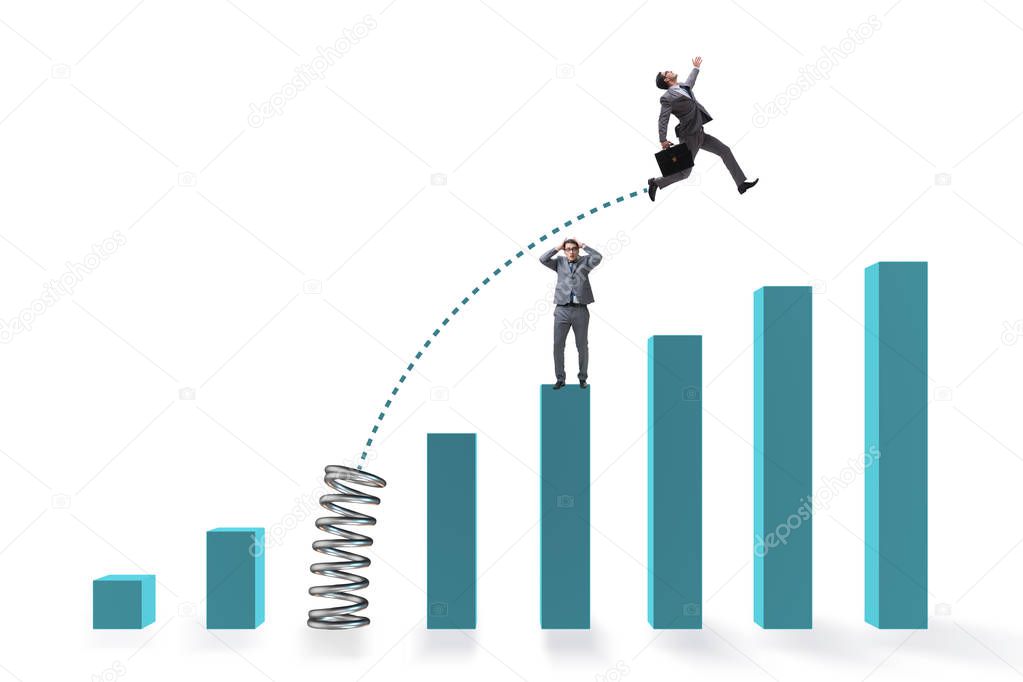 Businessman outperforming his competition jumping over