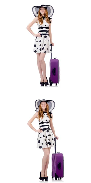 Vacker kvinna i prickig klänning med resväska isolerad på whi — Stockfoto