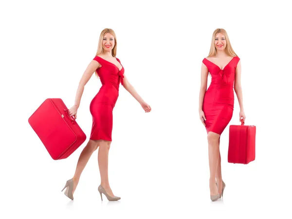 Blondýnka v červených šatech s kufrem izolovaných na bílém — Stock fotografie